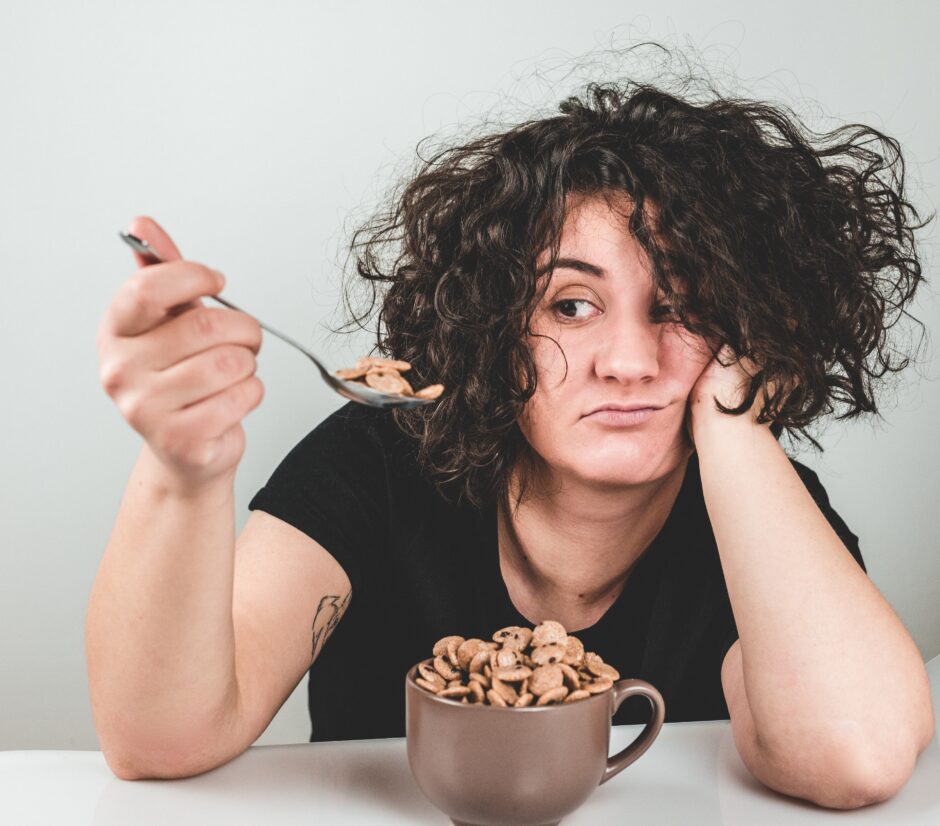 Unhappy girl is stress-eating carbs