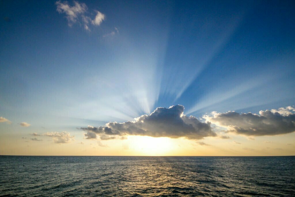 The image of sunrise over the ocean is symbolic of awakening to spirit.