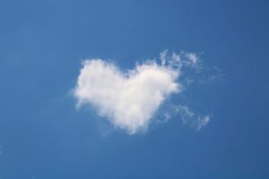 White heart-shaped cloud, as a symbol for the spirituality.
