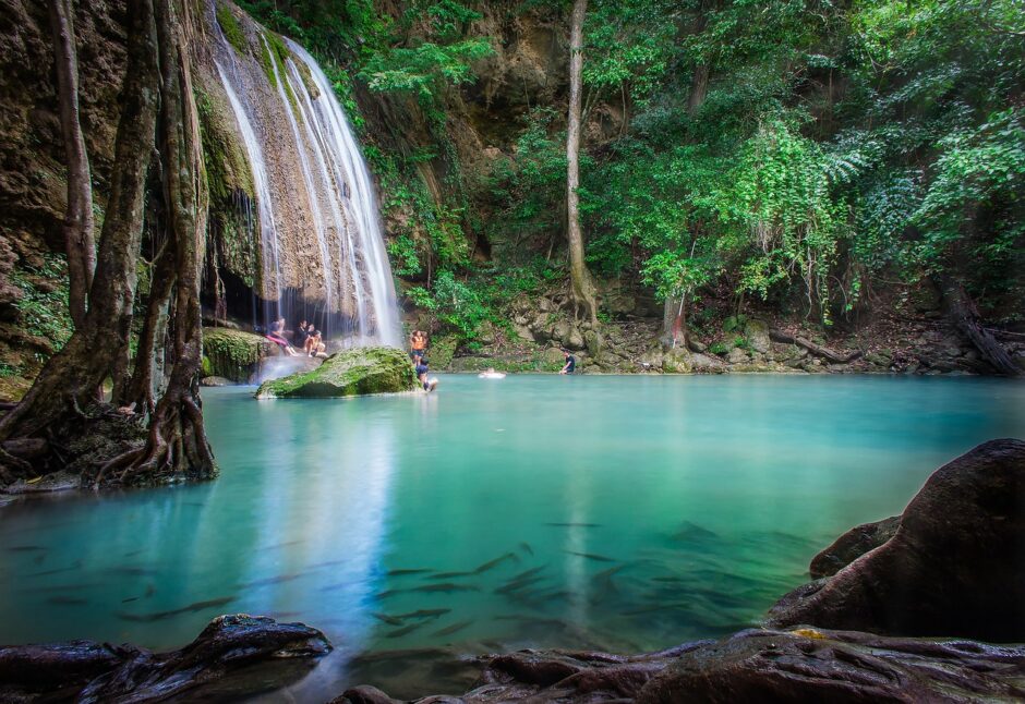 Playing in waterfall in forest helps us care for the soul.