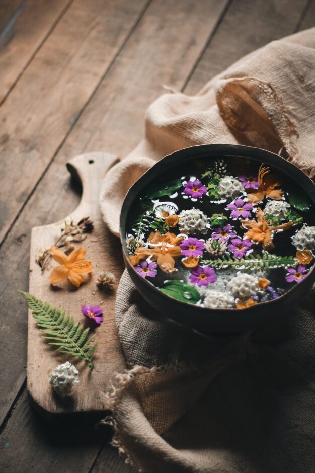 Flowers in a bowl of water. Flower remedies alleviate chronic stress.