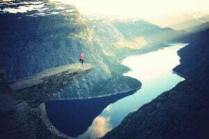 Yoga on ledge in beauty -Yoga promotes psycho-spiritual healing