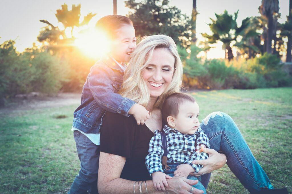 Mother with 2 children in nature